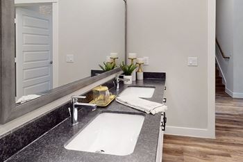 a bathroom with a sink and a mirror